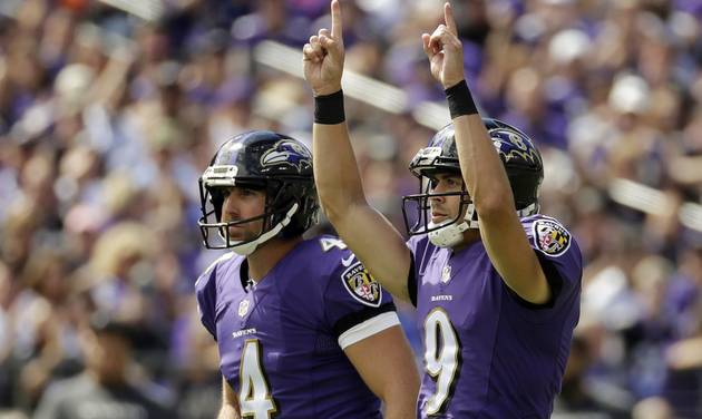 Baltimore Ravens kicker Justin Tucker celebrates his field goal as he walks off the field with teammate Sam Koch during the first half of an NFL football game against the Buffalo Bills in Baltimore Sunday Sept. 11 2016. (AP