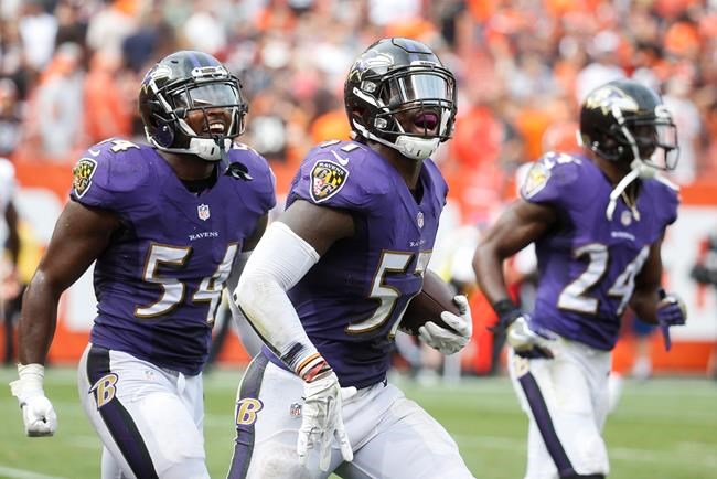 Baltimore Ravens inside linebacker C.J. Mosley center celebrates alongside inside linebacker Zach Orr and cornerback Shareece Wright after catching an interception in the final seconds of the second half of an NFL football game against the Cle