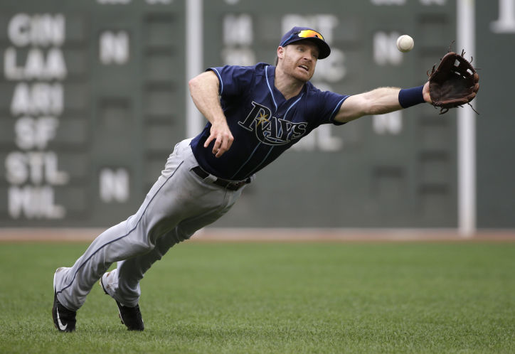 Rays second baseman Logan Forsythe dives but can't make a play on a single by Boston Red Sox's Sandy Leon in the fourth inning