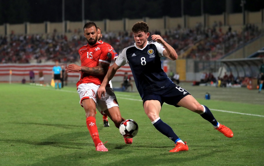 Herald Scotland Malta's Steve Borg and Scotland's Oliver Burke battle for the ball during the 2018 FIFA World Cup Qualifying match at the Ta'Qali National Stadium Malta. PRESS ASSOCIATION