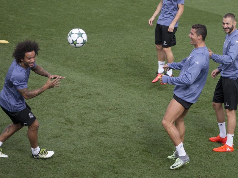 Real Madrid's Marcelo Cristiano Ronaldo and Karim Benzema enjoy a training session in Madrid