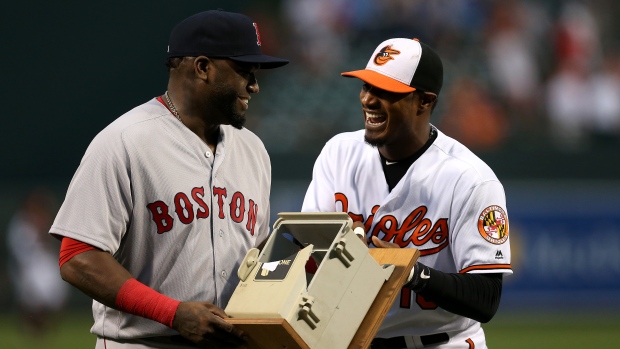 David Ortiz left shares a laugh with Baltimore Orioles&#39 Adam Jones on Thursday. The Boston slugger was given the phone box he destroyed in the visiting dugout in a 2013 game