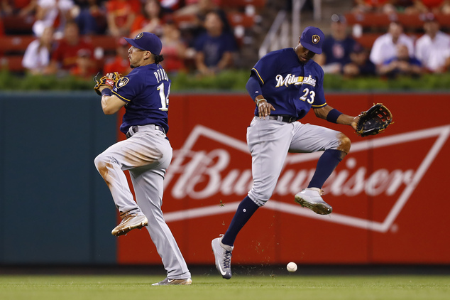 Milwaukee Brewers second baseman Hernan Perez left and center fielder Keon Broxton cannot come up with a ball hit by St. Louis Cardinals Jedd Gyorko durin