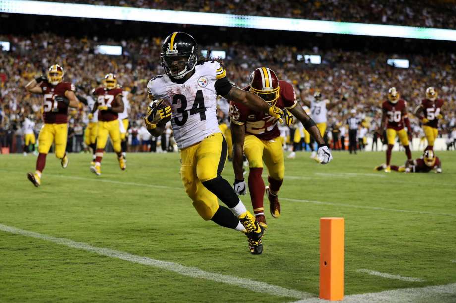 LANDOVER MD- SEPTEMBER 12 Running back De Angelo Williams #34 of the Pittsburgh Steelers scores a fourth quarter touchdown past strong safety De Angelo Hall #23 of the Washington Redskins at FedExField