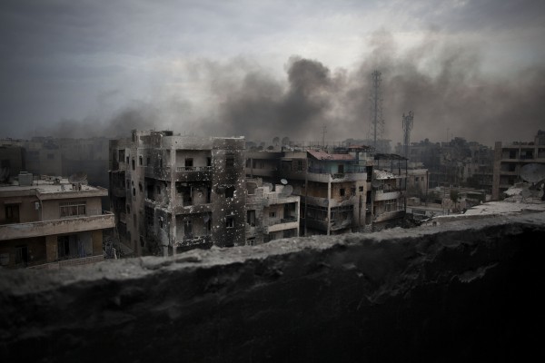 Smoke rises over Saif Al Dawla district Aleppo