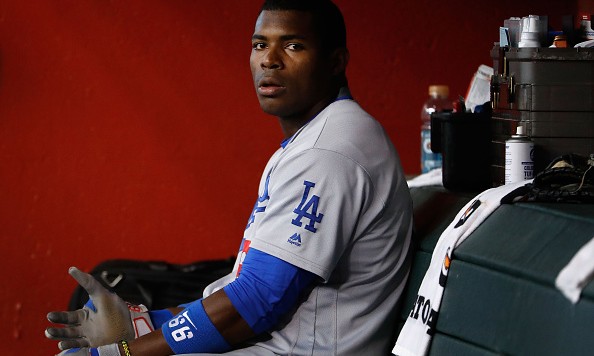 PHOENIX AZ- JULY 16 Yasiel Puig #66 of the Los Angeles Dodgers sits in the dugout after batting against the Arizona Diamondbacks during fourth inning of the MLB game at Chase Field