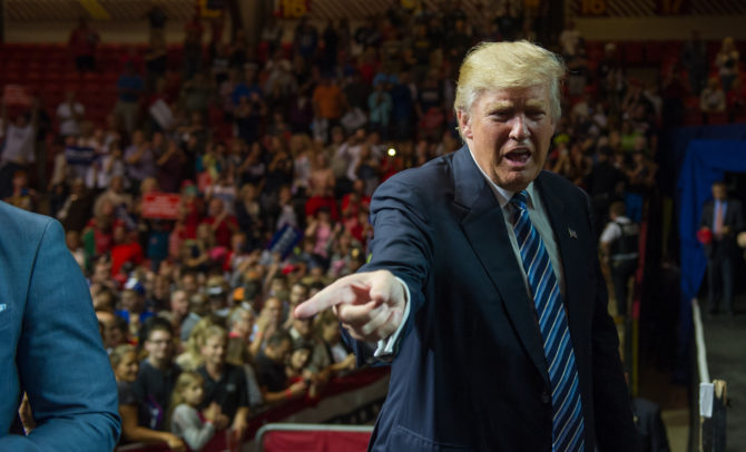 Republican Presidential candidate Donald Trump greets supporters during a campaign rally in Canton Ohio