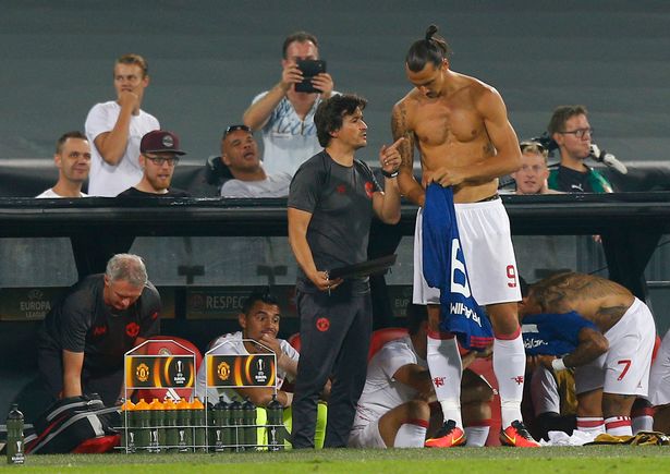 Manchester United's Zlatan Ibrahimovic receives intructions from assistant manager Rui Faria before coming