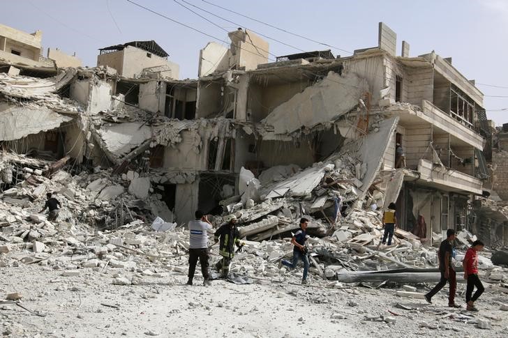 ReutersA damaged site after airstrikes on the rebel-held al Qaterji neighbourhood of Aleppo