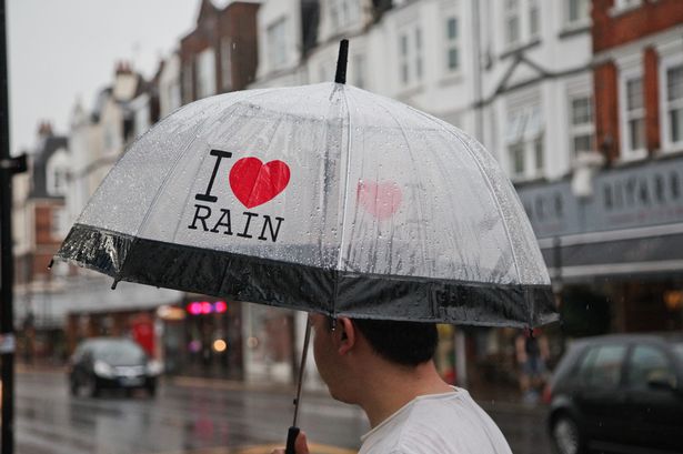 Rex

Commuters and shoppers with umbrellas brave the rain