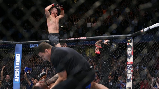 Stipe Miocic reacts after beating Alistair Overeem during the UFC 203