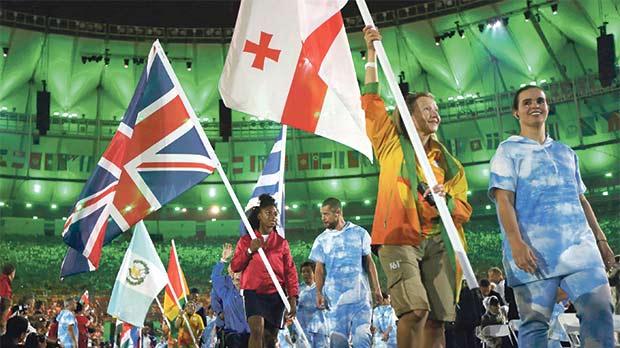 Flag-bearers hold their national flags as they take part in the closing ceremony in Rio on Sunday