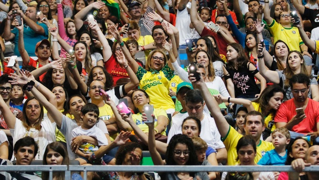 Spectators dance and cheer during the women's sitting volleyball preliminary game between Iran and the USA at the 2016 Paralympic Games in Rio de Janeiro Brazil Saturday Sept. 10 2016. | AP