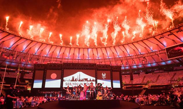 IOC a sign saying'see you in Tokyo appears behind Koichi Omae and four female dancers are joined on stage by GIMICO Aya Sato and Bambi walking triumphantly down the runway gathering around Akira Hiyama during the closing