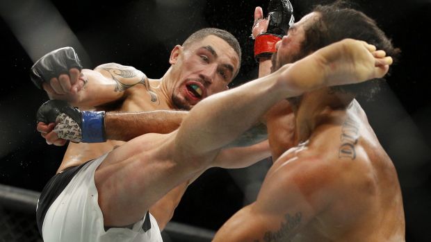 Robert Whittaker kicks Rafael Natal at UFC 197. Australia's highest-ranked UFC fighter will next take on Derek