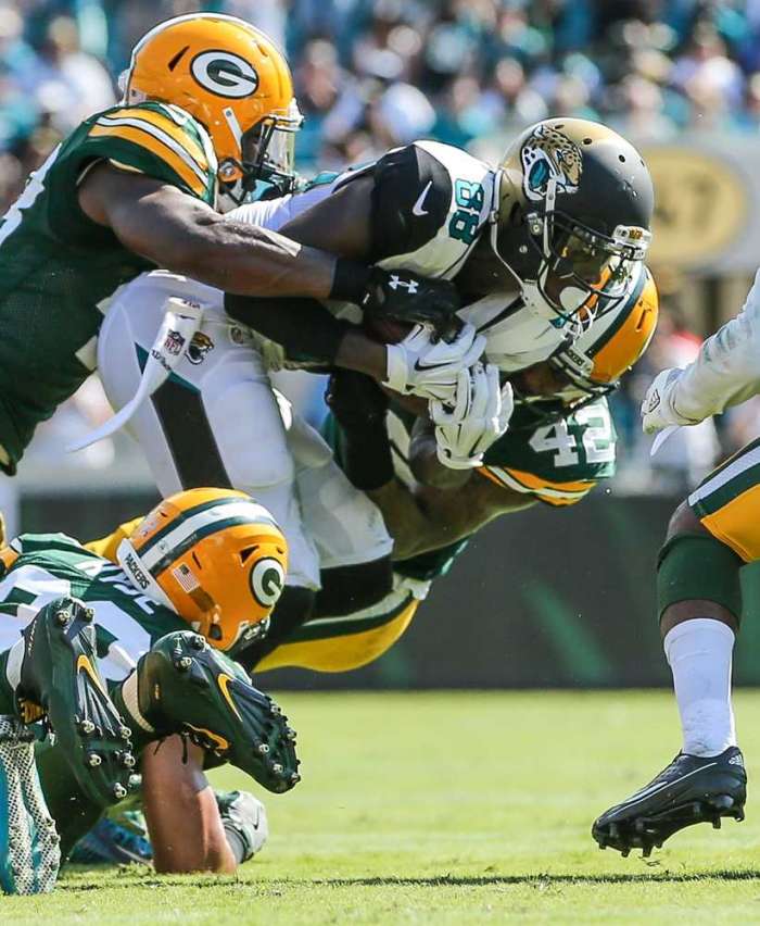 Jaguars receiver Allen Hurns catches a short pass on fourth-and-1 but is tackled by Packers linebacker Joe Thomas and strong safety Morgan Burnett for no gain to end the Jaguars&#039 final drive in Sunday's game at Ever Bank Field. Gary