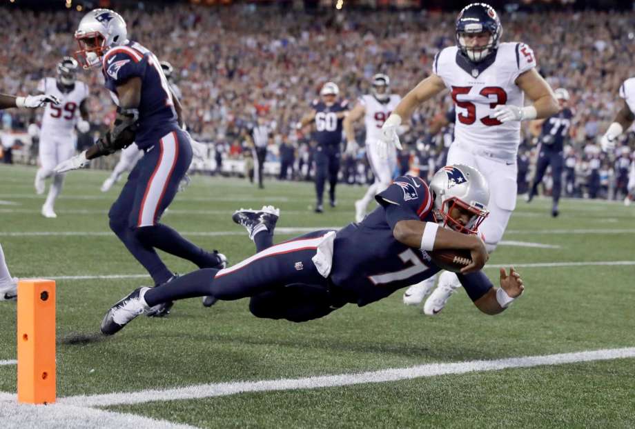 New England Patriots quarterback Jacoby Brissett dives into the end zone for a touchdown past Houston Texans linebacker Max Bullough during the first half of an NFL football game Thursday Sept. 22 2016 in Foxborough Mass. (AP