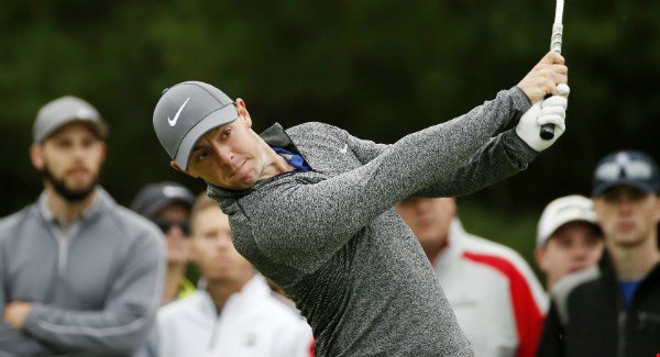 Rory Mc Ilroy tees off on the third hole during the final round of the Deutsche Bank Championship golf tournament. AP