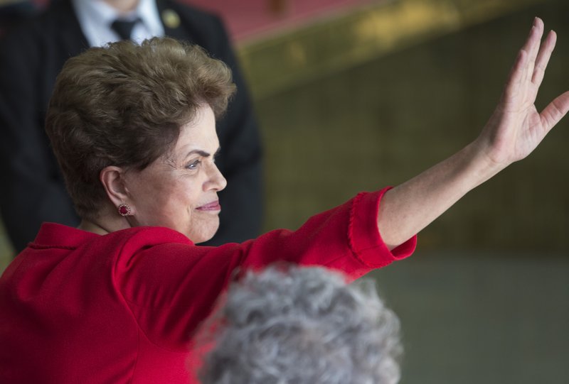 President Dilma Rousseff waves to supporters before speaking from the official residence of the president Alvorada Palace in Brasilia Brazil Wednesday Aug. 31 2016. In her first remarks after being ousted as Brazil's president Rousseff is vowin