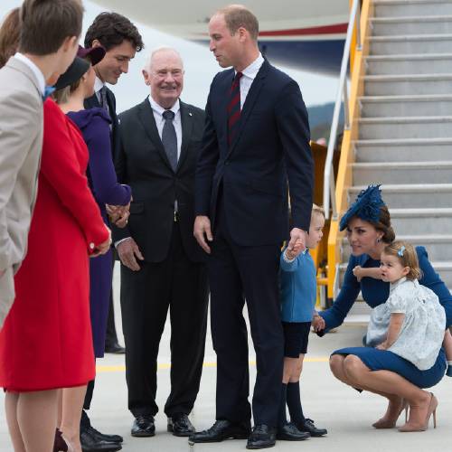 Minister Justin Trudeau back left greets Prince William The Duke of Cambridge as Governor General David Johnston back looks on upon the arrival of the Duke and Duchess of Cambridge Kate and their children Prince George and