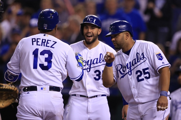 Salvador Perez congratulated by teammates