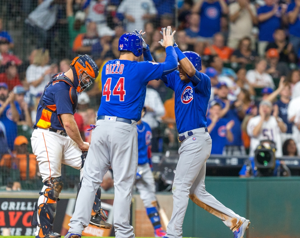 Chicago Cubs Anthony Rizzo high-fives Addison Russell after hitting a two run home-run in the fourth inning of a baseball game between the Houston Astros and the Chicago Cubs Sunday Sept. 11 2016 in Houston