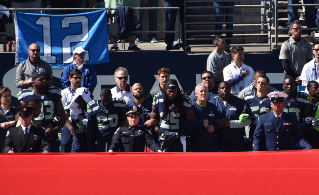 Seahawks lock arms in unity during national anthem 4 Dolphins take a knee