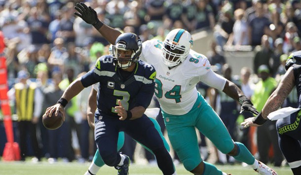 Sep 11 2016 Seattle WA USA Seattle Seahawks quarterback Russell Wilson is sacked by Miami Dolphins defensive end Mario Williams during the first quarter at Century Link Field