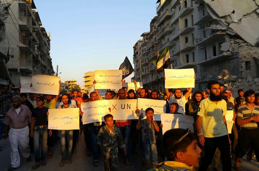 Activists in Syria's besieged city of Aleppo protest Tuesday against the United Nations for what they say is its failure to lift the siege of their rebel-held area.'Hunger better than humiliation' one banner read.'X the UN' another declared