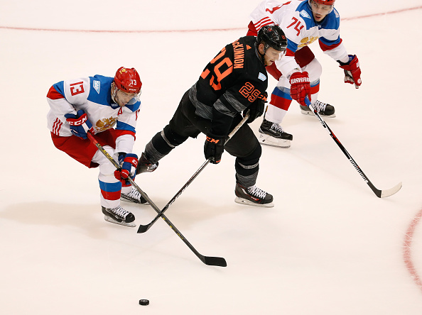 Russia's Pavel Datsyuk takes the puck away from Team North America's Nathan Mac Kinnon