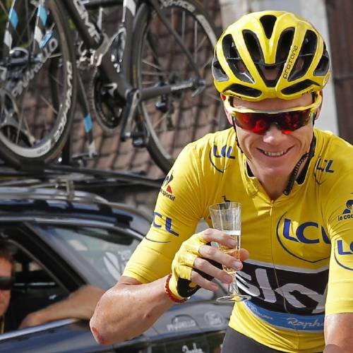 Froome wearing the overall leader's yellow jersey celebrates with a glass of champagne during the twenty-first stage of the Tour de France in Paris. Three-time Tour