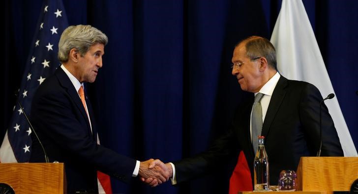 U.S. Secretary of State John Kerry and Russian Foreign Minister Sergei Lavrov shake hands at the conclusion of their press conference following their meeting in Geneva Switzerland where they discussed the crisis in Syria