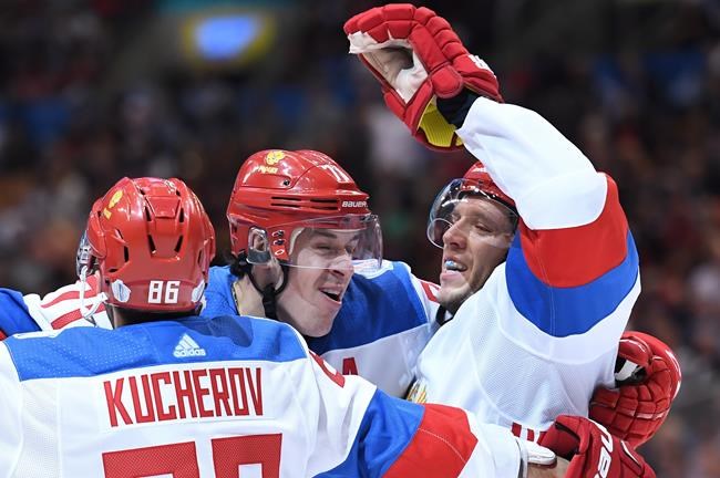 Team Russia's Nikita Kucherov is congratulated on his goal by Evgeni Malkin and Nikolay Kulemin during second period World Cup of Hockey action against Team North America in Toronto on Monday