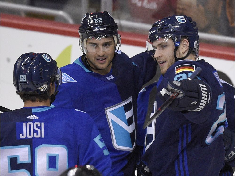 Europe forward Leon Draisaitl right of Germany celebrates his goal against Sweden with forward Nino Niederreiter, and defenseman Roman Josi, both of Switzerland during the third period of an exhibition game part of the World Cup of Hockey