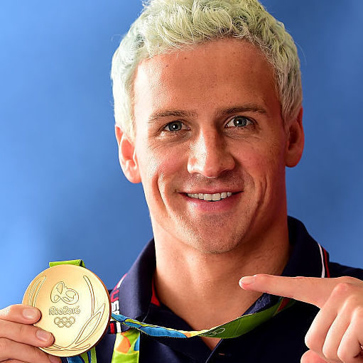 Ryan Lochte poses with his gold medal.   Harry How    
  Getty Images