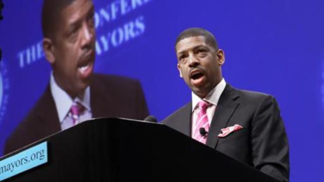 Sacramento Calif. Mayor Kevin Johnson president of the U.S. Conference of Mayors speaks before a panel discussion about sports and race relations during a conference meeting in Dallas. A man hit Mayor