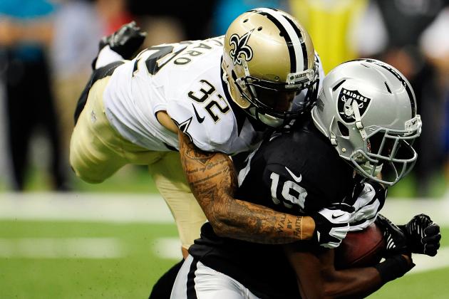 Aug 16 2013 New Orleans LA USA Oakland Raiders wide receiver Brice Butler is tackled by New Orleans Saints strong safety Kenny Vaccaro in the first half at the Mercedes Benz Superdome. New Orleans defeated Oakland 28-20. Mandatory Credit C