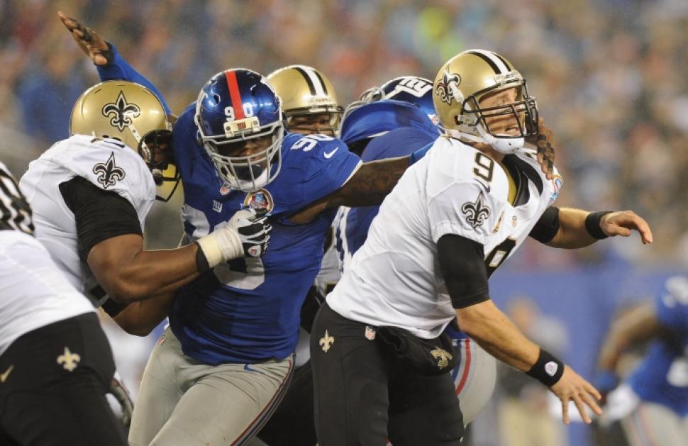 Dec 9 2012 East Rutherford NJ USA New York Giants defensive end Jason Pierre Paul grabs at New Orleans Saints quarterback Drew Brees during the second quarter at Met Life Stadium. Mandatory Credit Brad Penner-USA TODAY Sports