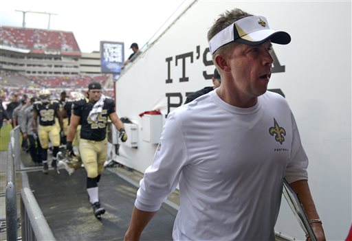 Sep 15 2013 Tampa FL USA New Orleans Saints head coach Sean Payton right leaves the field after lightning forced a weather delay during the first half of an NFL football game against the Tampa Bay Buccaneers at Raymond James Stadium. Mandatory Cred