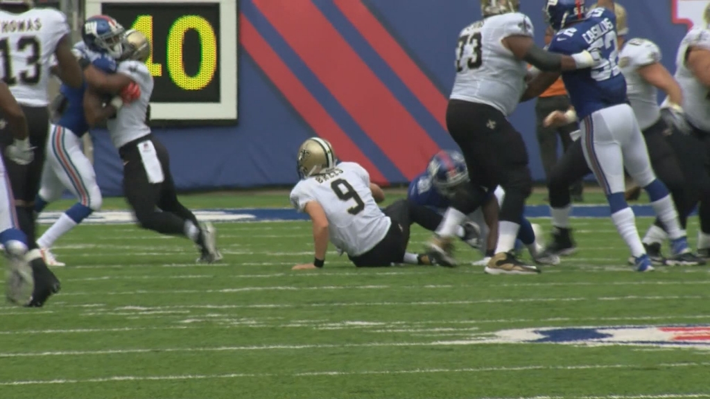 Saints quarterback Drew Brees is sacked during the Giants game