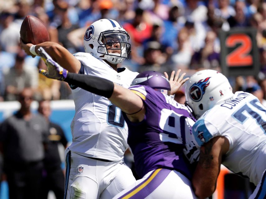 Tennessee Titans quarterback Marcus Mariota passes