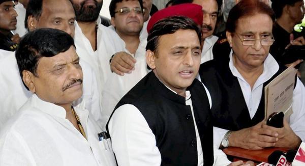 Akhilesh Yadav flanked by State unit chief Shivpal Yadav and Azam Khan while addressing the media in Lucknow on Tuesday PTI