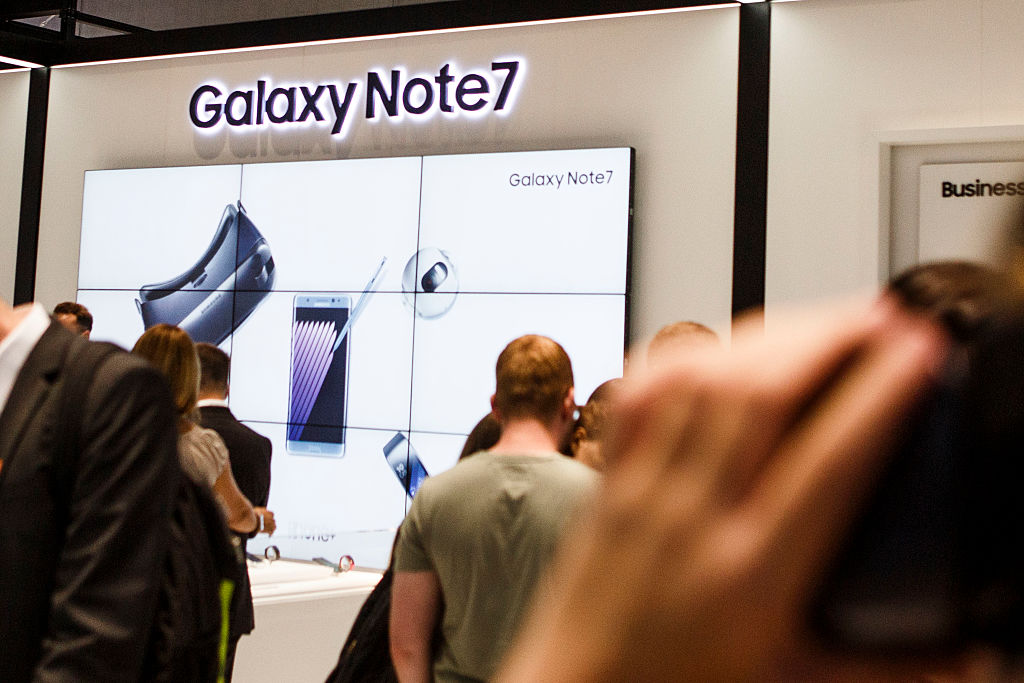 BERLIN GERMANY- SEPTEMBER 02 Visitors visit the stand of Samsung to watch the Galaxy Note 7 at the 2016 IFA consumer electronics trade fair