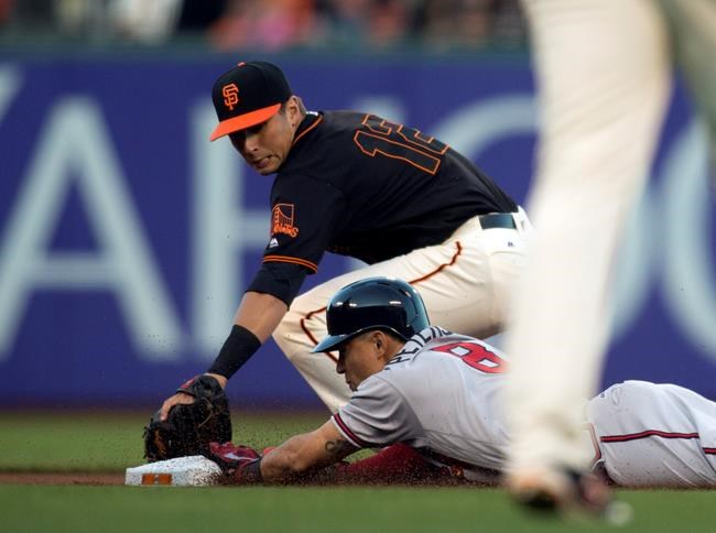 Atlanta Braves&#39 Jace Peterson slides into second base ahead of the tag by San Francisco Giants&#39 Joe Panik for a double during the fourth inning of a baseball game Saturday Aug. 27 2016 in San Francisco