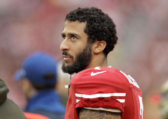 San Francisco 49ers quarterback Colin Kaepernick stands on the field during a 2015 game