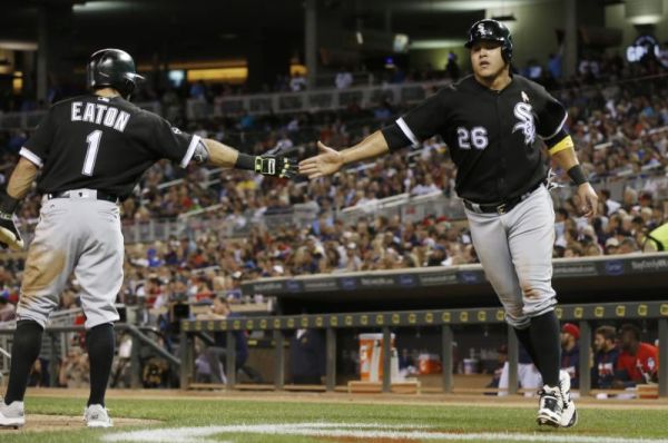 Chicago White Sox's Adam Eaton left congratulates Avisail