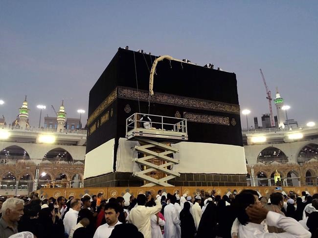 Saudi workers change the Kiswah in Mecca Saudi Arabia Sunday Sept. 11 2016. Workers change the Kiswah once a year when pilgrims leave for the plains of Mount Arafat during the Hajj