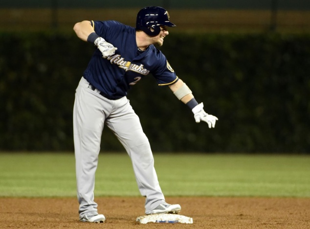 Scooter Gennett of the Milwaukee Brewers reacts after hitting a two-RBI double against the Chicago Cubs