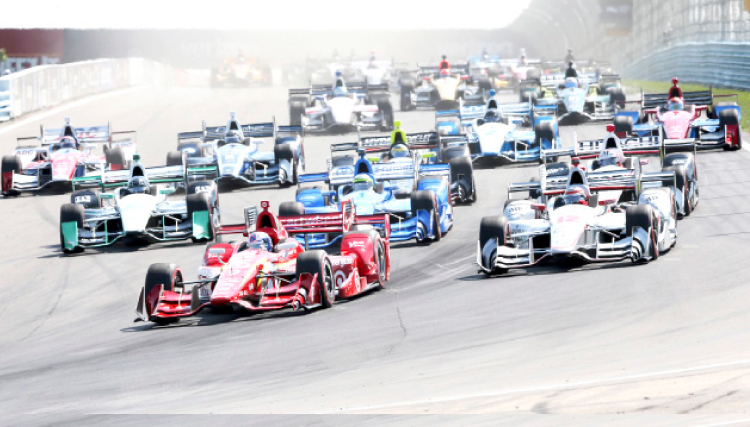 Scott Dixon,of New Zealand leads into Turn 1 at the start of the Indy Car Grand Prix at the Glen auto race in Watkins Glen N.Y. Sunday. — AP