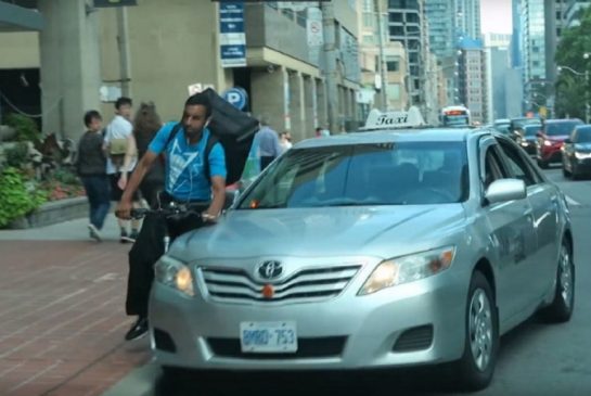 A bystander took video of a collision between a food courier cyclist and taxicab on Aug. 18